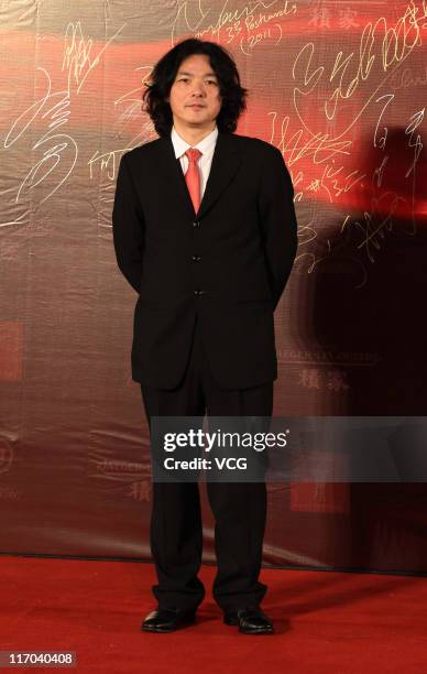 Japanese director Shunji Iwai arrives at the red carpet of the 14th Shanghai International Film Festival closing ceremony at Shanghai Grand Theatre...