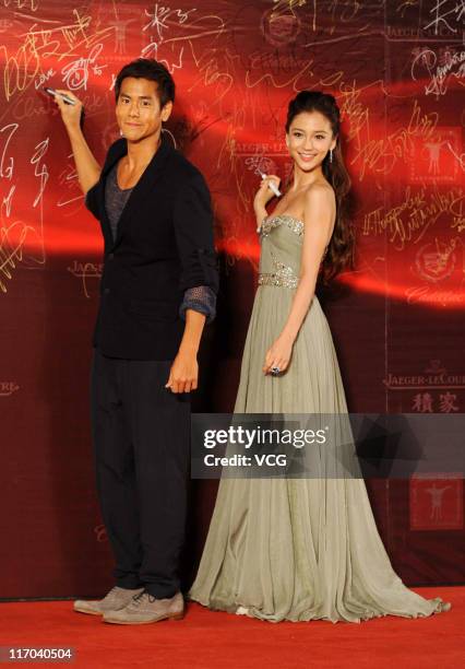 Taiwanese actor Eddie Peng and Hong Kong actress Angelababy arrive at the red carpet of the 14th Shanghai International Film Festival closing...