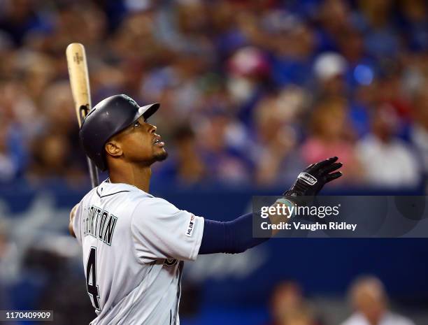 Keon Broxton of the Seattle Mariners hits a sacrifice fly as Daniel Volgelbach scores a run in the fourth inning during a MLB game against the...