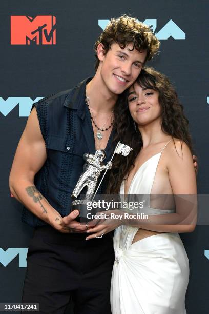 Shawn Mendes and Camila Cabello pose with the Best Collaboration Award in the Press Room during the 2019 MTV Video Music Awards at Prudential Center...