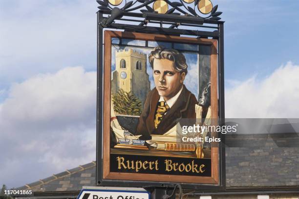Sign for the Rupert Brooke pub which depicts the English poet who is most famous for his war poetry, Grantchester, Cambridge, circa 1990.