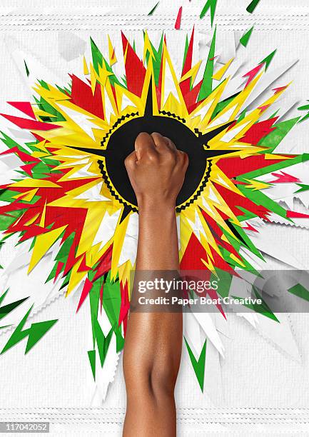 hand with paper craft of a colorful explosion - black craft paper stock pictures, royalty-free photos & images