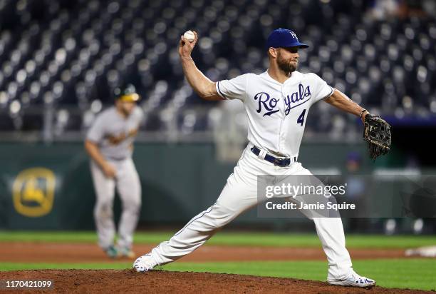 Left-fielder Alex Gordon of the Kansas City Royals pitches during the 8th inning of the game against the Oakland Athletics at Kauffman Stadium on...