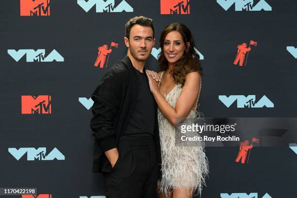 Kevin Jonas and Danielle Jonas pose in the Press Room during the 2019 MTV Video Music Awards at Prudential Center on August 26, 2019 in Newark, New...
