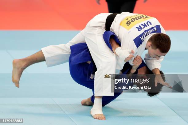 Eric Ham of Great Britain and Artem Khomula of Ukraine compete in the Men's -73kg Pool B second round on day three of the World Judo Championships at...