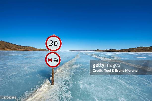 russia, siberia, baikal lake, road on frozen lake - sibirien bildbanksfoton och bilder
