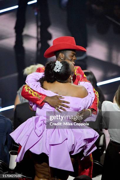 Lizzo and Lil Nas X embrace onstage during the 2019 MTV Video Music Awards at Prudential Center on August 26, 2019 in Newark, New Jersey.