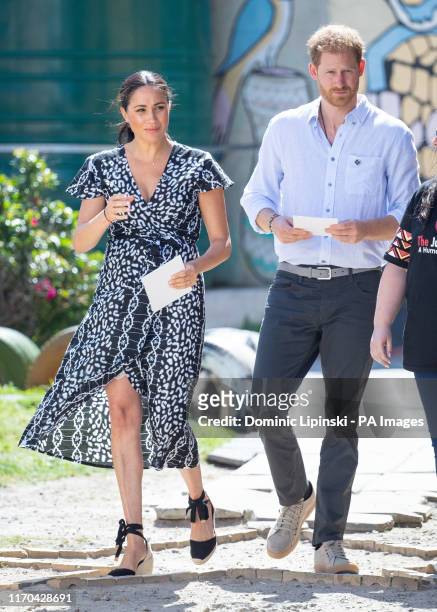 The Duke and Duchess of Sussex during a visit to the Nyanga Township in Cape Town, South Africa, on the first day of their tour of Africa. PA Photo....