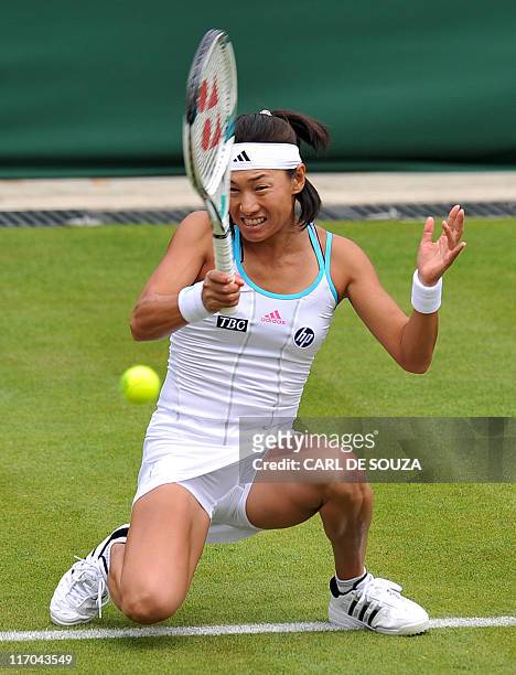 Japanese player Kimiko Date-Krumm plays against British player Katie O'Brien during the 2011 Wimbledon Tennis Championships at the All England Tennis...