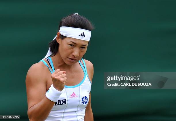 Japanese player Kimiko Date-Krumm reacts as she plays against British player Katie O'Brien during the 2011 Wimbledon Tennis Championships at the All...