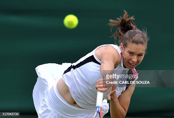 British player Katie O'Brien plays against Japanese player Kimiko Date-Krumm during the 2011 Wimbledon Tennis Championships at the All England Tennis...