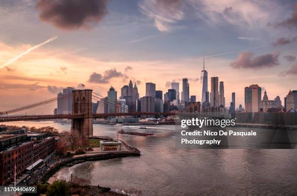 brooklyn bridge and lower manhattan - skyline dusk stock pictures, royalty-free photos & images