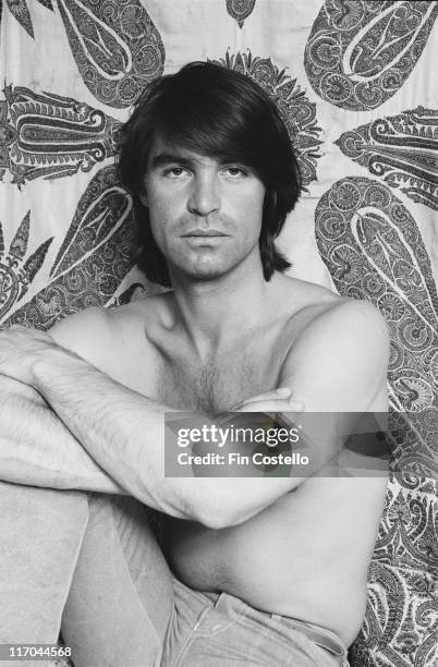 Oliver Tobias, Swiss-born actor, poses bare-chested for a studio portrait, circa 1980.