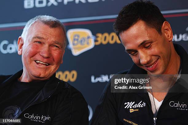 Felix Sturm of Germany and his coach Fritz Sdunek react during the Felix Sturm v Matthew Macklin press conference at Hotel Im Wasserturm on June 20,...