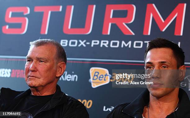 Felix Sturm of Germany and his coach Fritz Sdunek react during the Felix Sturm v Matthew Macklin press conference at Hotel Im Wasserturm on June 20,...