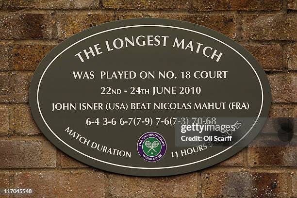 View of the plaque hanging outside court 18 stating 'The Longest Match' in honor of the match played by John Isner and Nicolas Mahut during Wimbledon...