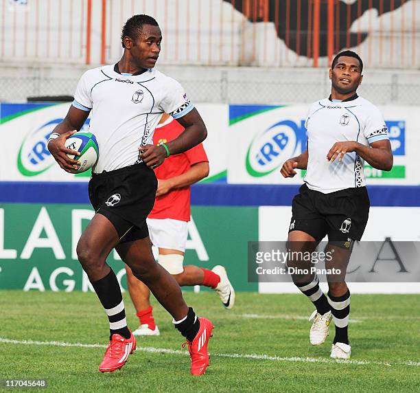Semi Radrada of Fiji scores a breakaway try during the IRB Junior World Championship match between Fiji and Tonga at Mario Battaglini Stadium on June...