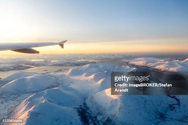 aerial view, snow-covered mountains with fjord, province tromsoe, tromsoe, norway - finnmark county stock pictures, royalty-free photos & images