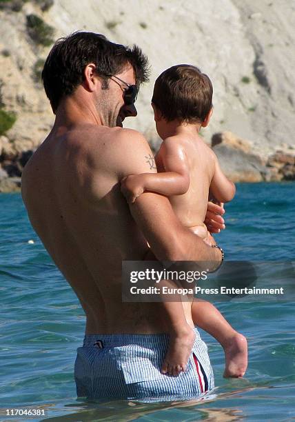 Valencia football player David Albelda and his son are seen sighting on June 20, 2011 in Ibiza, Spain.
