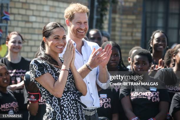 Prince Harry, Duke of Sussex and Meghan, Duchess of Sussex arrive for a visit to the "Justice desk", an NGO in the township of Nyanga in Cape Town,...