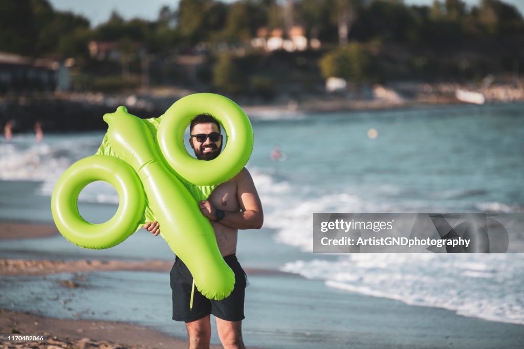 Man holding inflatable toy