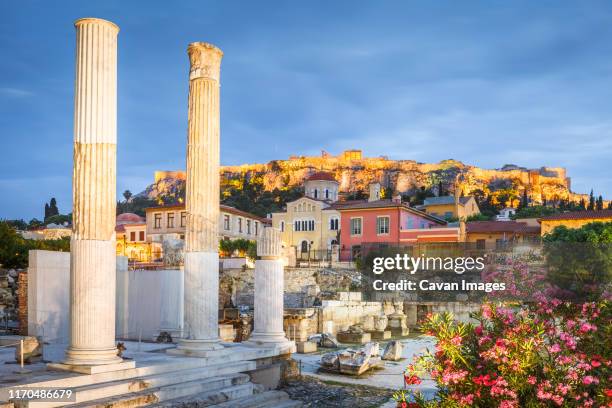 remains of hadrian's library and acropolis in the old town of athens. - athens greece stock pictures, royalty-free photos & images