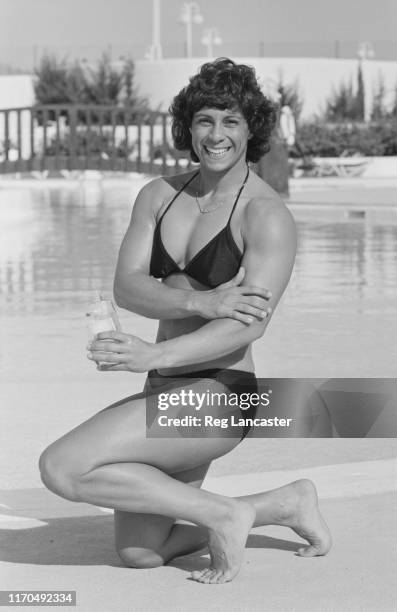 British javelin thrower Fatima Whitbread by a swimming pool, UK, 5th March 1984.