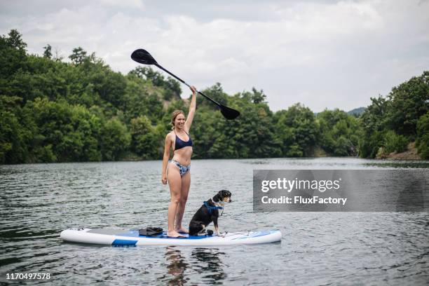 joyful woman celebrating her successful day of practicing - reliability stock pictures, royalty-free photos & images