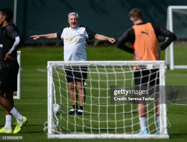 Newcastle United Head Coach Steve Bruce gives instructions on the pitch during the Newcastle United Training Session at the Newcastle United Training...