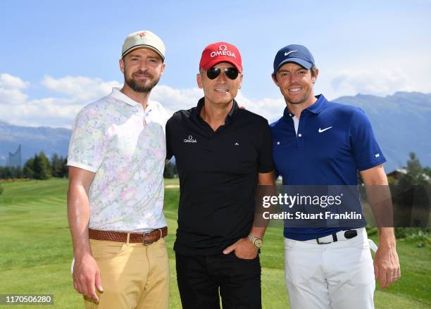 Singer Justin Timberlake, Raynald Aeschlimann, President of Omega and Rory McIlroy of Northern Ireland pose for a picture prior to the start of the...