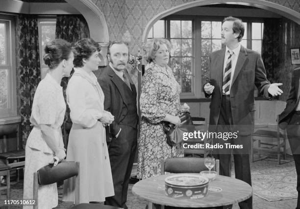 Actors Una Stubbs, Denyse Alexander, Roger Hume, Pat Keen and John Cleese in a scene from episode 'The Anniversary' of the BBC television sitcom...