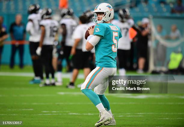 Jake Rudock of the Miami Dolphins warms up before the preseason game against the Jacksonville Jaguars at Hard Rock Stadium on August 22, 2019 in...