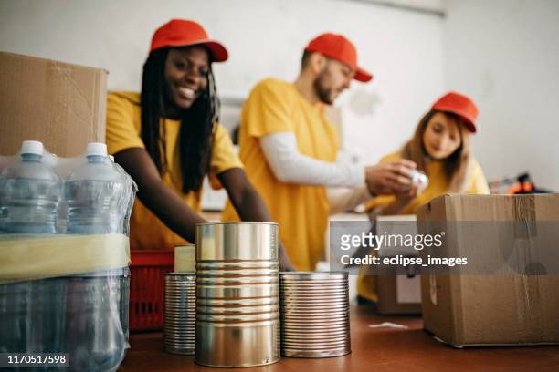we are team of charitable people - canned food drive stock pictures, royalty-free photos & images