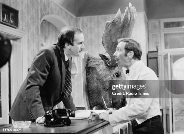 Actors John Cleese and Andrew Sachs in a scene from episode 'The Germans' of the BBC television sitcom 'Fawlty Towers', August 31st 1975.