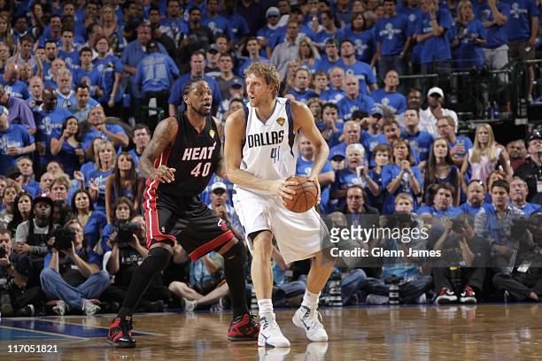 Dallas Mavericks power forward Dirk Nowitzki protects the ball from Miami Heat power forward Udonis Haslem in Game Five of the 2011 NBA Finals...