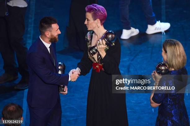 Best FIFA Men's Player of 2019, Argentina and Barcelona forward Lionel Messi shakes hand with Best FIFA Women's Player of 2019, US and Reign FC...