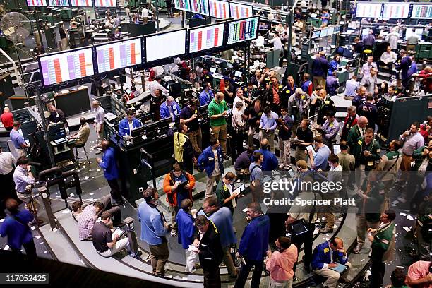 Traders work in the crude oil and natural gas options pit on the floor of the New York Mercantile Exchange on June 20, 2011 in New York City....