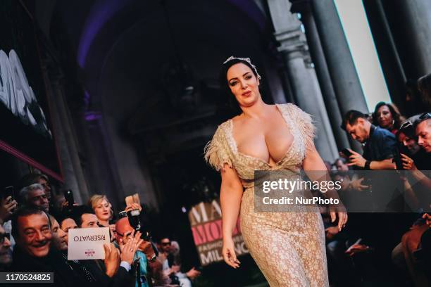 Model walks the runway at the Mad Mood show during the Milan Fashion Week Spring/Summer 2020 on September 19, 2019 in Milan, Italy.