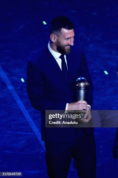 Lionel Messi gestures after receiving The Best FIFA Men's Player of the Year award during The Best FIFA Football Awards 2019 at Teatro alla Scala on...