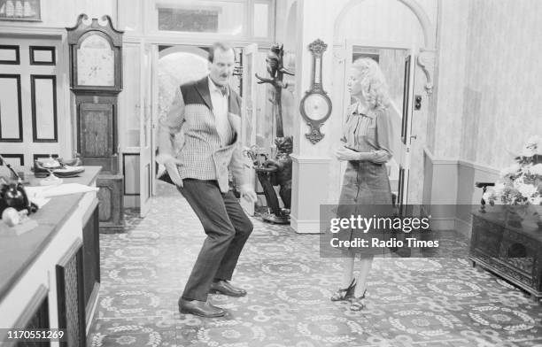 Actors John Cleese and Connie Booth in a scene from episode 'The Builders' of the BBC television sitcom 'Fawlty Towers', August 3rd 1975.