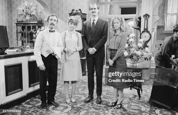 Actors Andrew Sachs, Prunella Scales, John Cleese, Connie Booth on the set of the BBC television sitcom 'Fawlty Towers', August 3rd 1975.