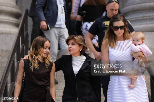 Attorney Gloria Allred leaves a New York court house with two women, a woman who did not wish to be identified and Teala Davies , who have publicly...