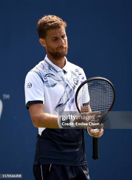 Martin Klizan of Slovakia looks on against Marin Cilic of Croatia during their Men's Singles first round match on day two of the 2019 US Open at the...