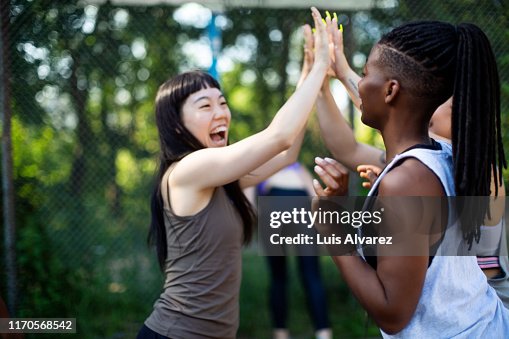Successful basketball players celebrating the victory Successful basketball players celebrating the victory
