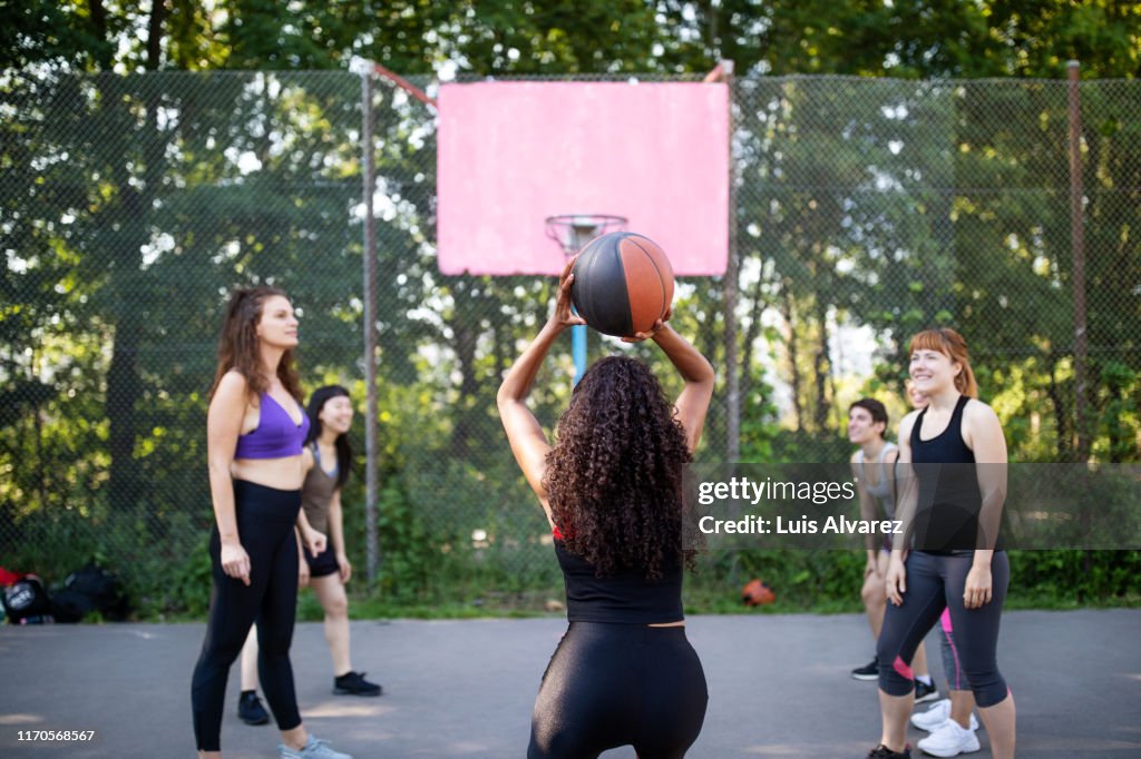 Female basketball player taking a free throw