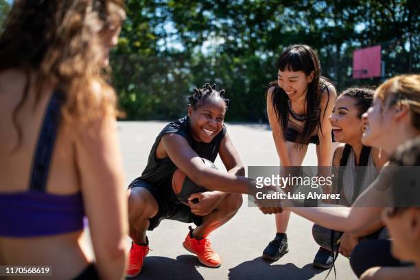 basketball player shaking hands during a game plan - basketball sport team stock pictures, royalty-free photos & images