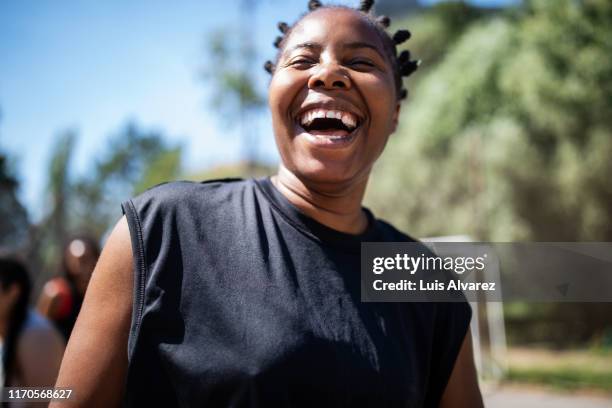 smiling basketball player outdoors - sports personality of the year stockfoto's en -beelden