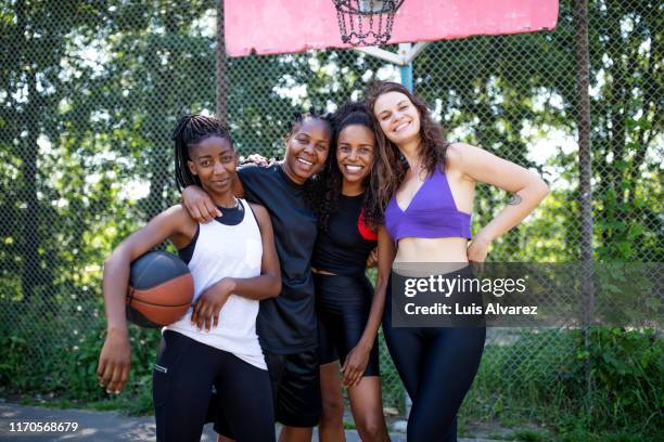 portrait of multiracial female friends on basketball court - women's basketball bildbanksfoton och bilder