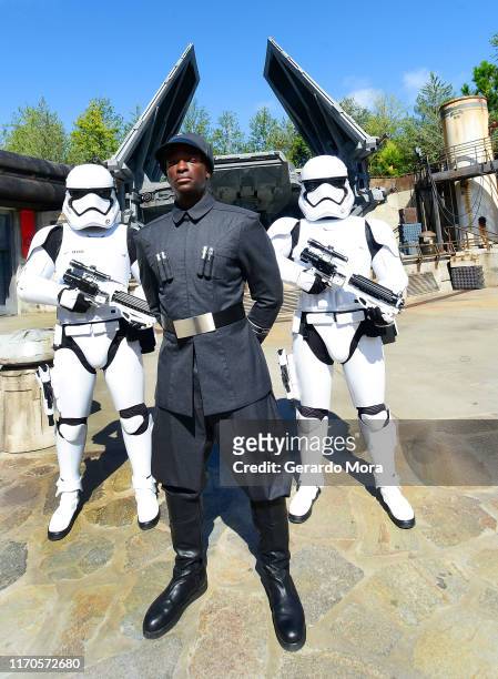 First Order officer and Storm Trooper pose in front of the TIE Echelon at the Star Wars: Galaxy's Edge Walt Disney World Resort Opening at Disney’s...