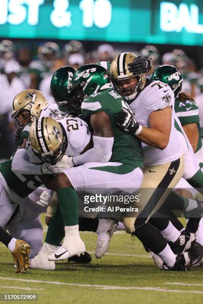 Linebacker Neville Hewitt and Defensive Lineman Bronson Kaufusi of the New York Jets in action against the New Orleans Saints at MetLife Stadium on...